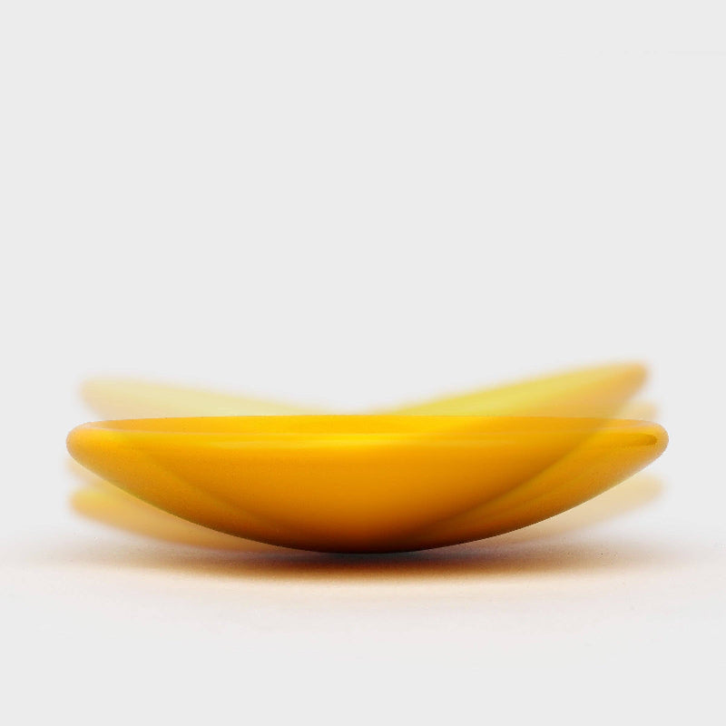 Yellow ceramic bowl on a white background