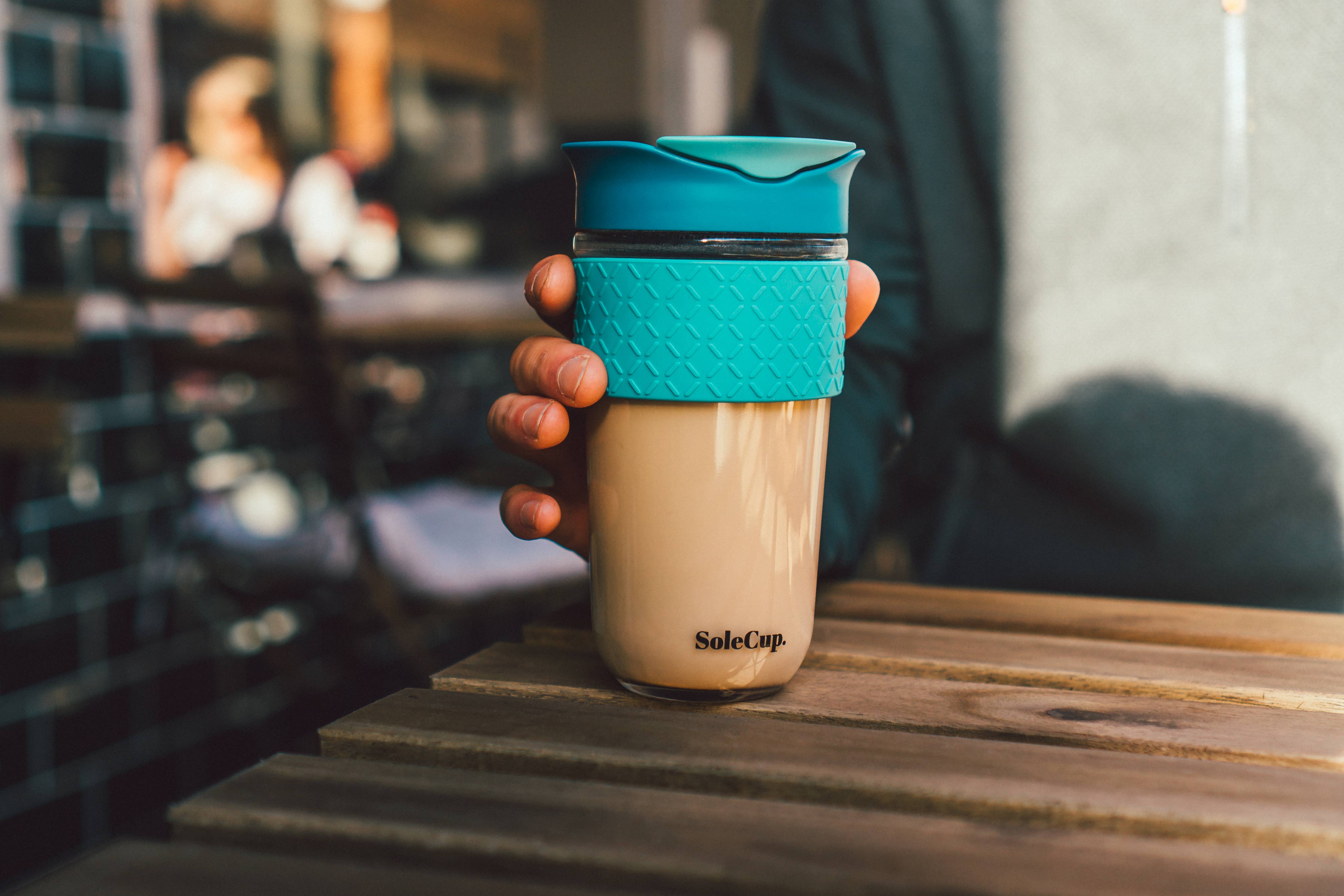 SoleCup Glass Travel Mug 18oz (530ml) with Loose Tea Infuser: Blue lifestyle cafe shot