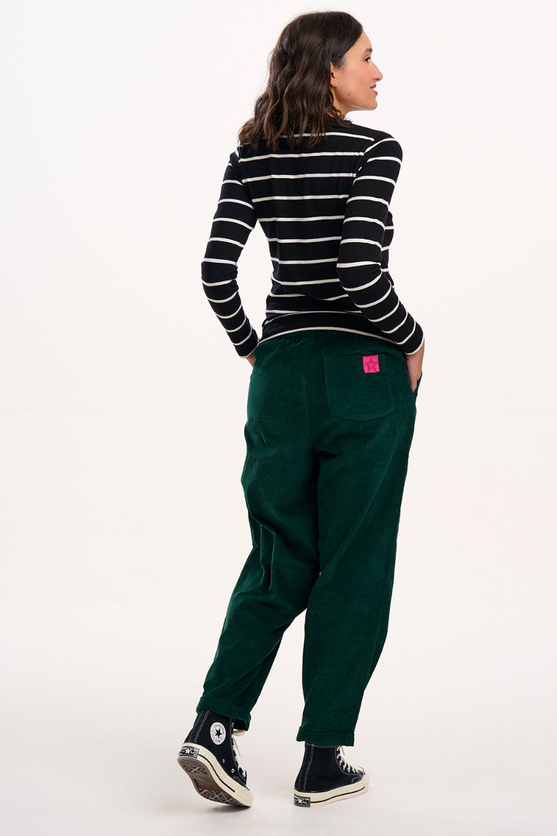 Person wearing Sugarhill Vonnie Trouser Green cords a black and white striped shirt