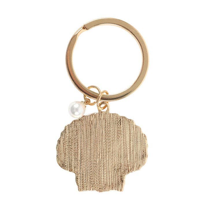 Gold keychain with a textured gold tag and pearl charm on a white background