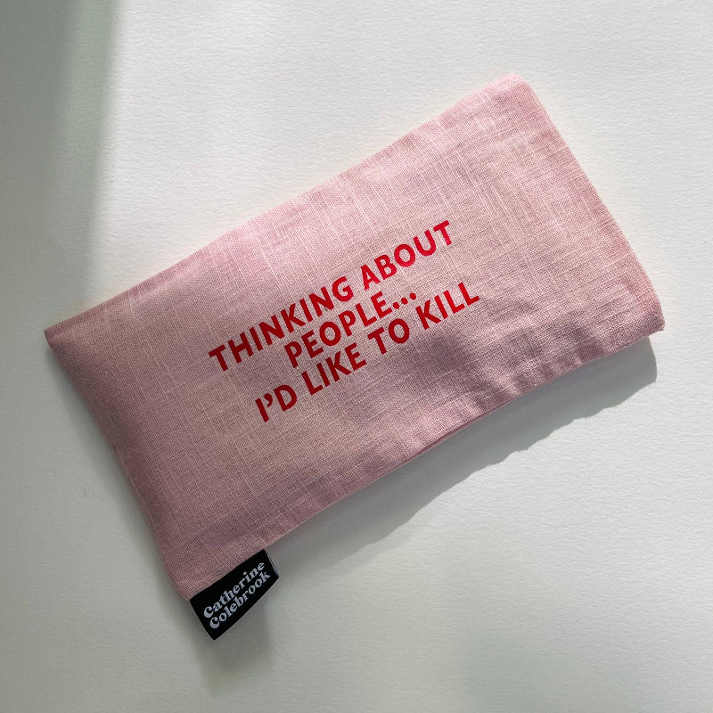 Pink pouch with red text on a white background
