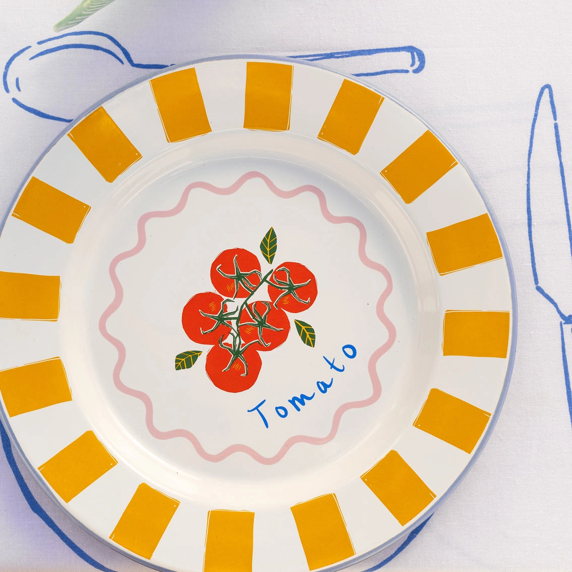 Bon Appetit Enamel Plate Tomato - 25cm on table cloth