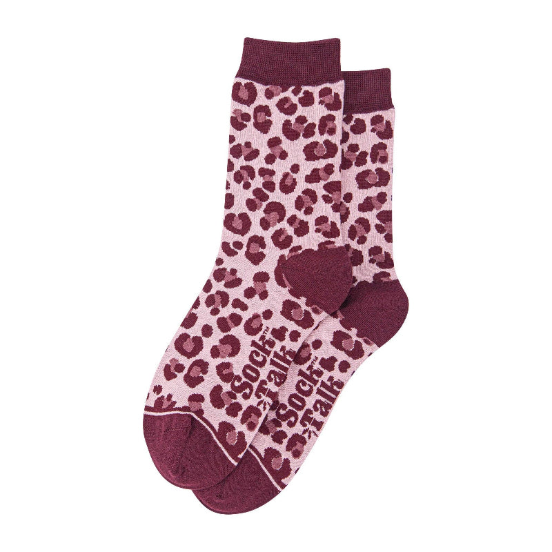 Pink socks with red leopard print and text on a white background