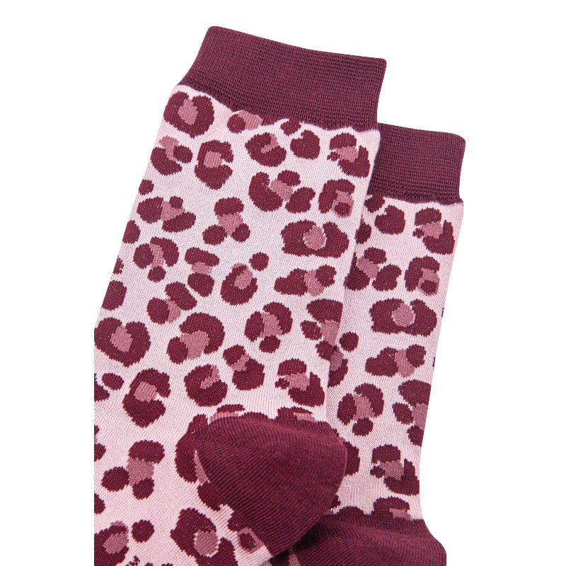 Pair of socks with pink and purple leopard print pattern on a white background