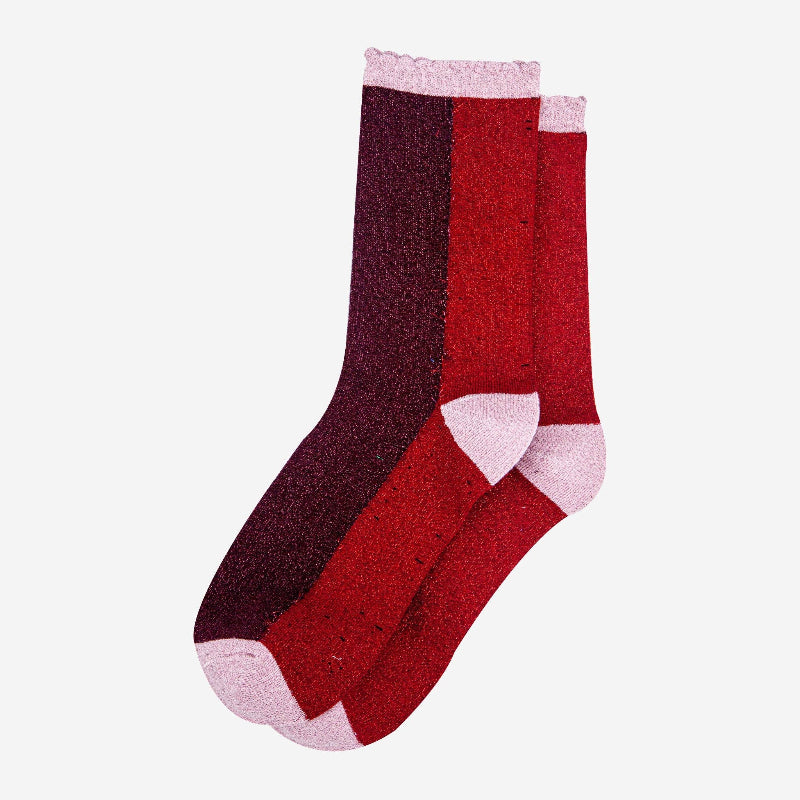 Pair of red and purple socks with pink accents on a white background