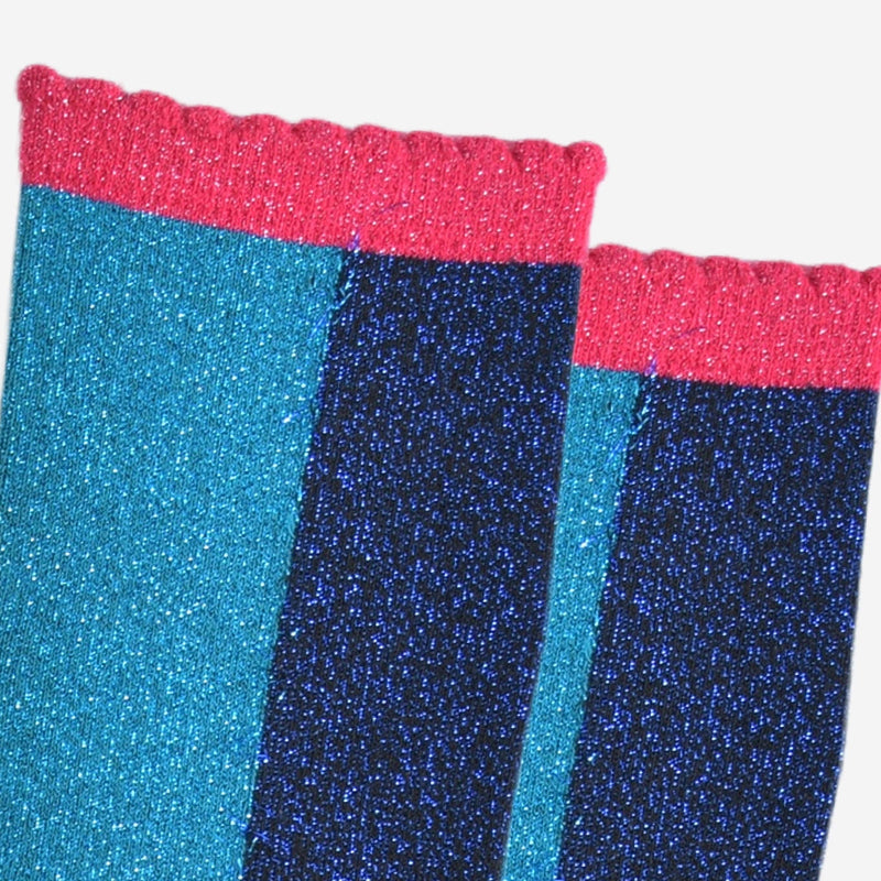 Close-up of glittery socks with red top and blue sides on a white background
