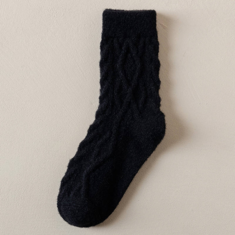 Black sock on a beige background
