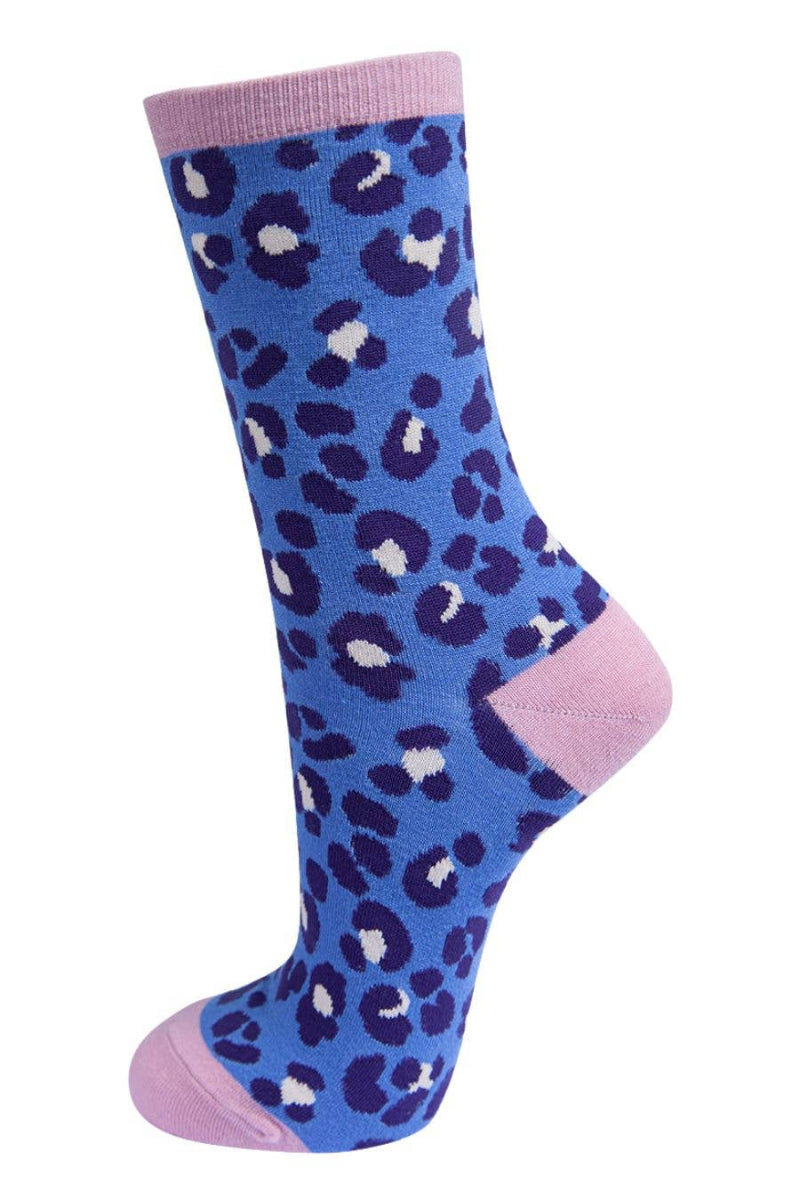 Blue leopard print sock with pink accents on a white background