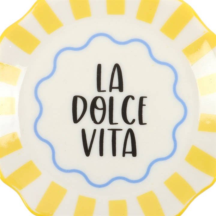 Decorative plate with 'La Dolce Vita' text and yellow and white striped border