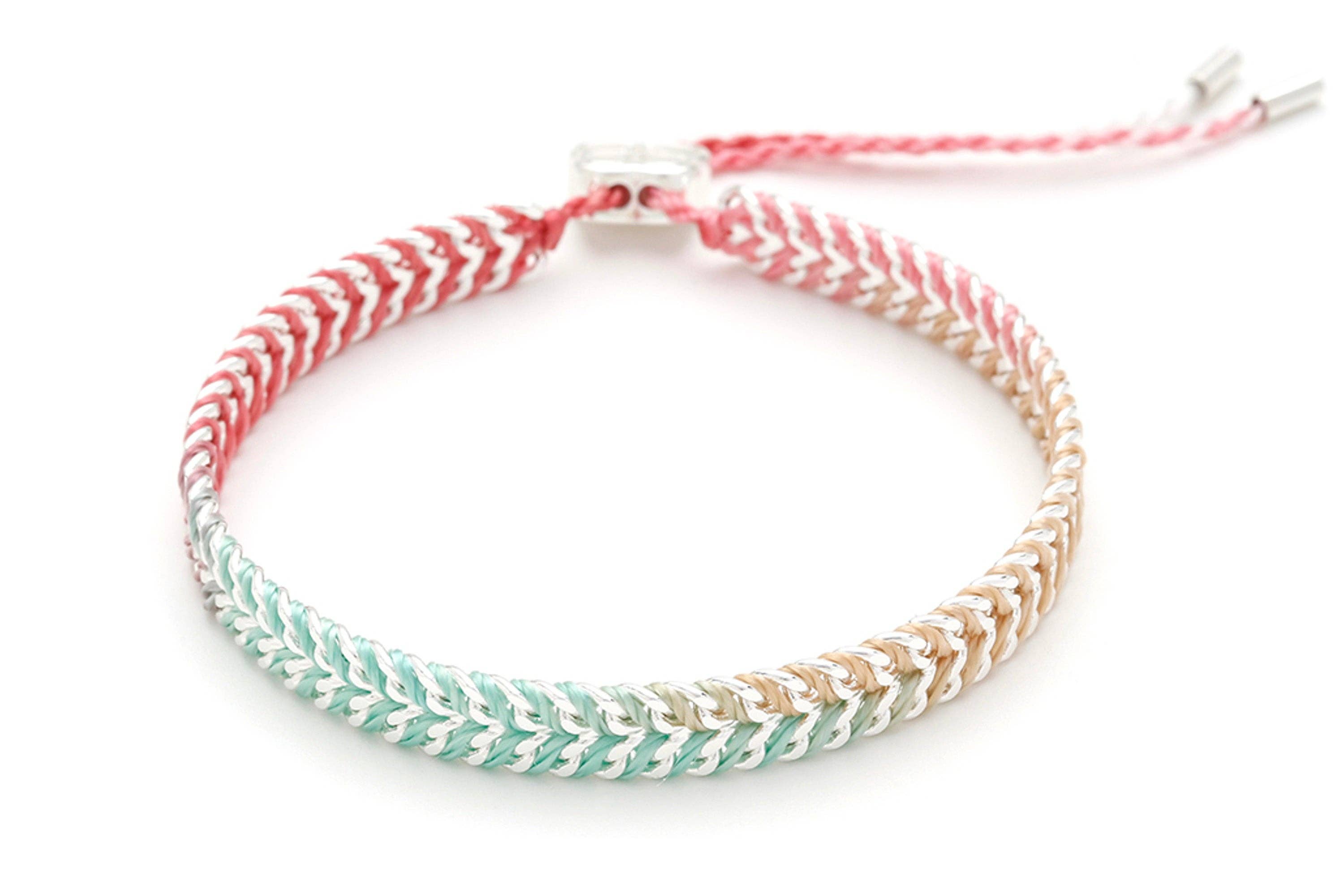 Multicolored braided bracelet on a white background