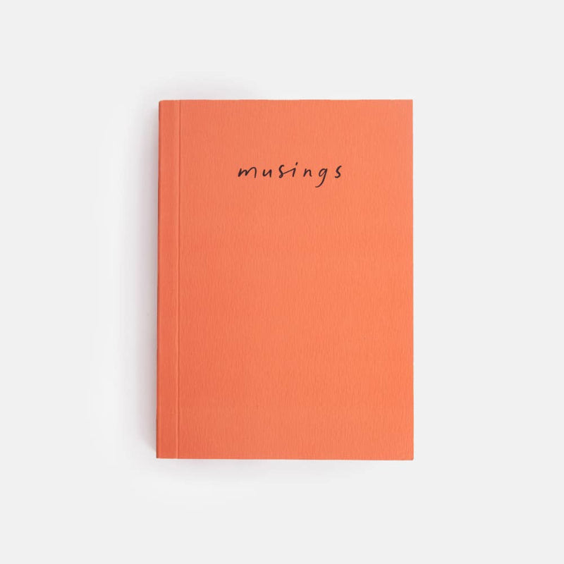 Caroline Gardiner Orange notebook with 'musings' text on a white background