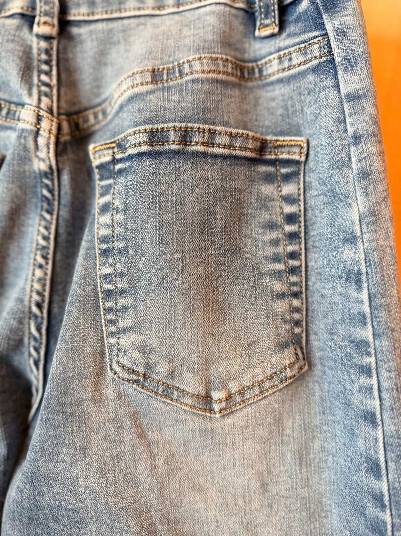 Close-up of a blue denim pocket on jeans.