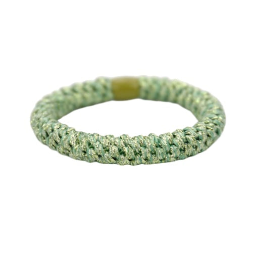 Green textured bracelet on a white background