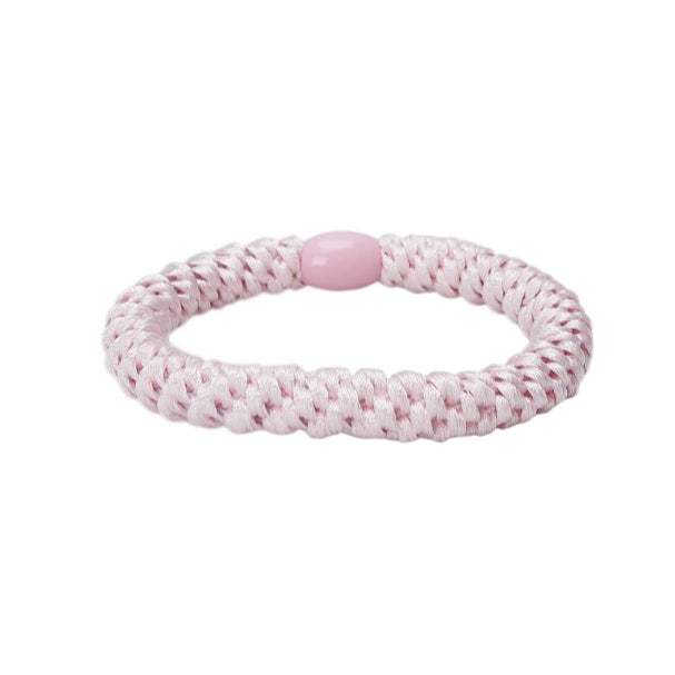 Pink textured bracelet on a white background