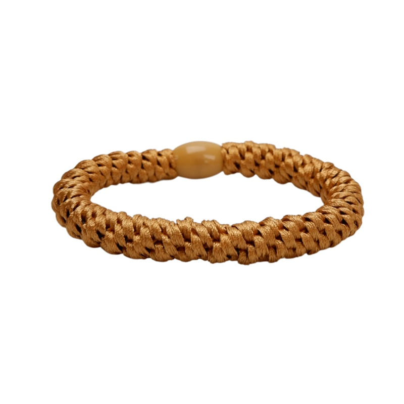 Brown woven bracelet on a white background