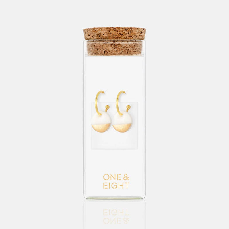 Product packaging with cork lid and 'ONE & EIGHT' branding on a white background