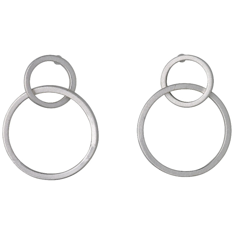Pair of silver hoop earrings on a white background