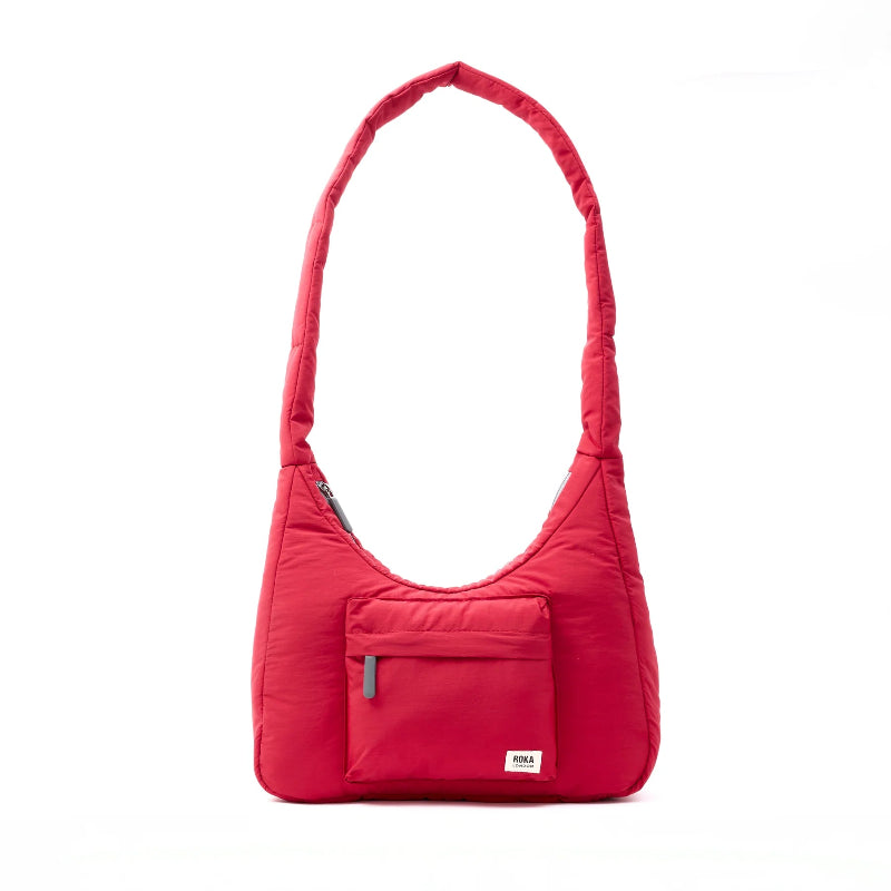 Red shoulder bag with a pocket on a white background