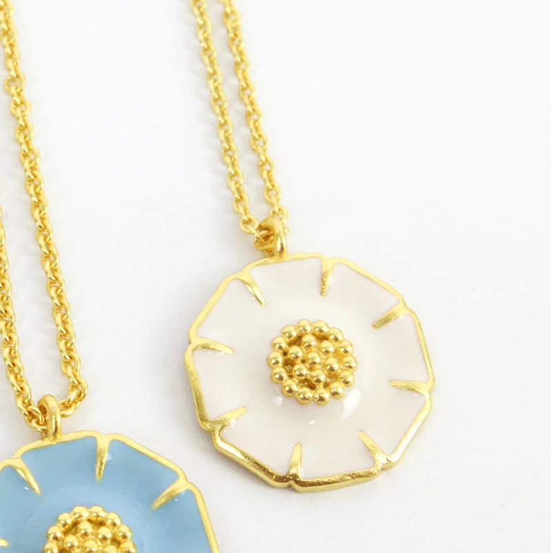 white enamel daisy pendant necklace in gold