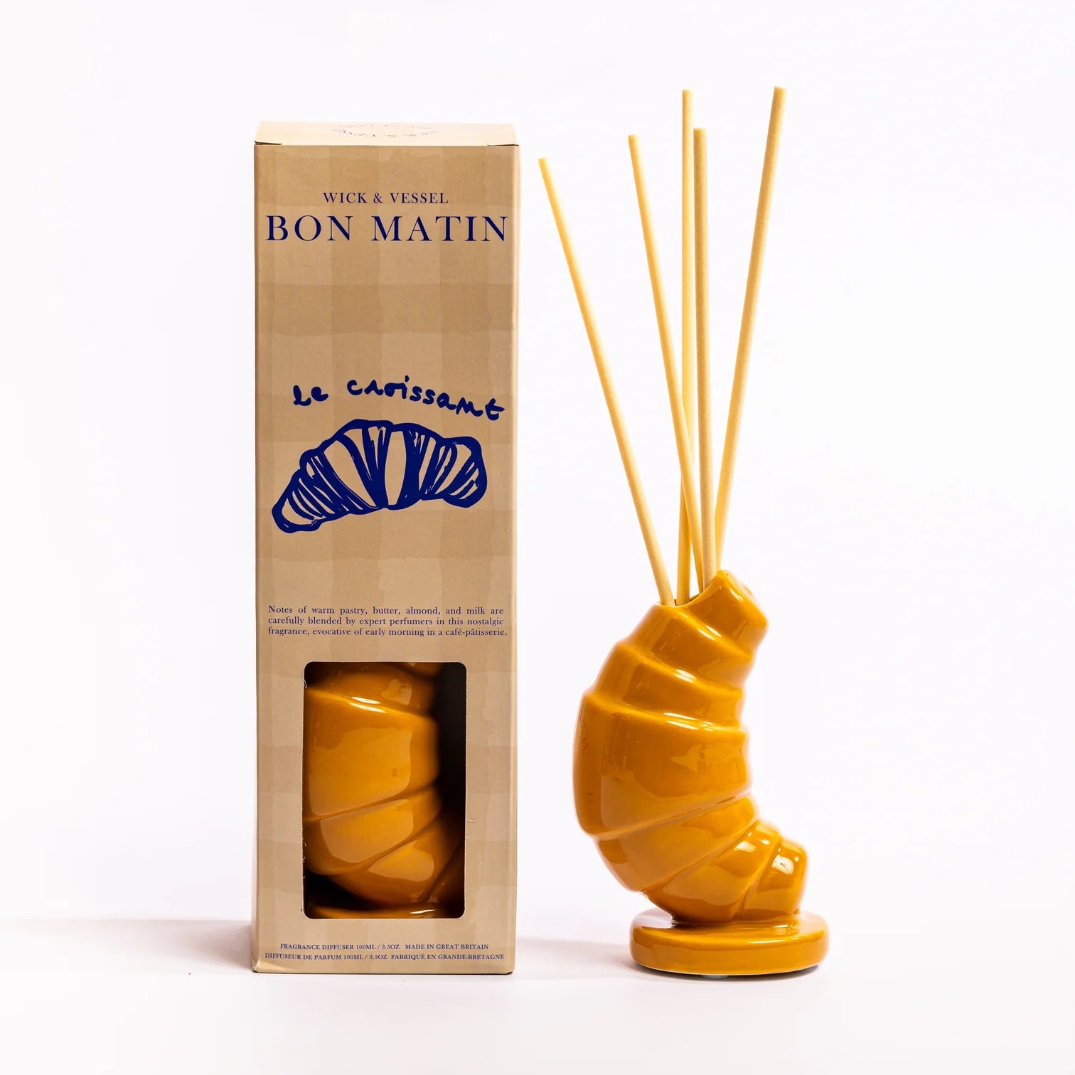 Yellow ceramic diffuser with packaging labeled 'Bon Matin' on a white background