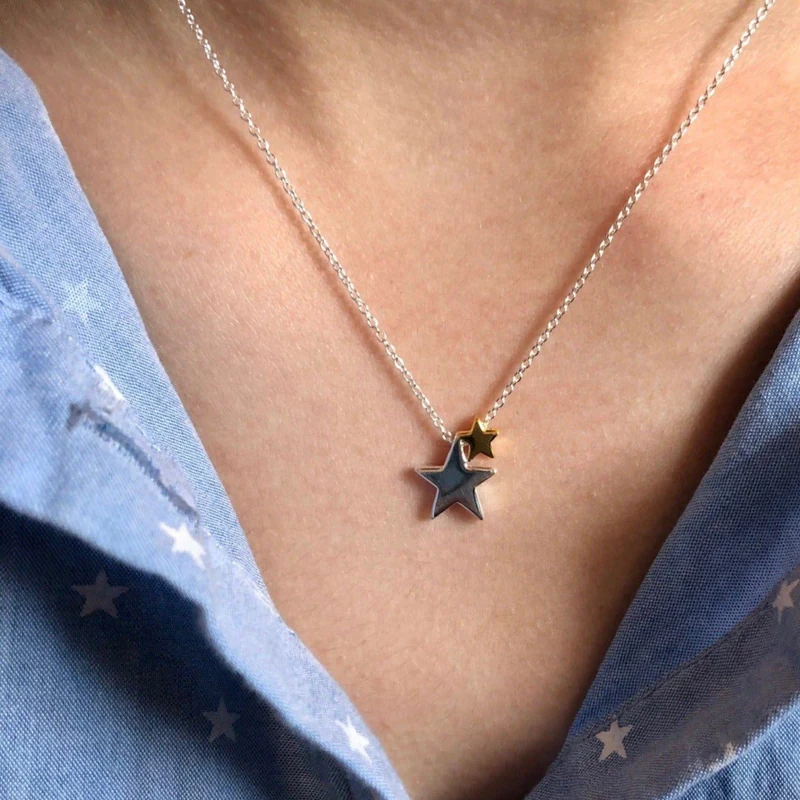 silver star necklace with two stars one in gold