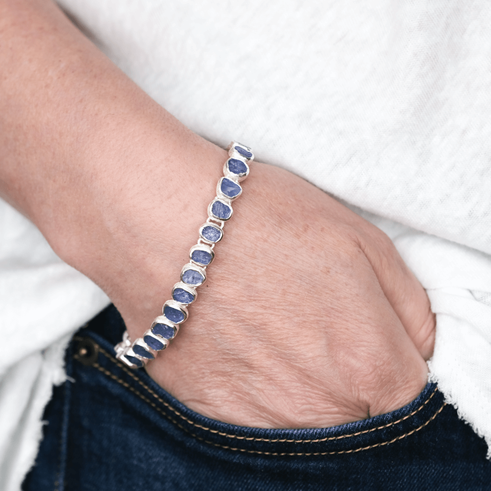 Tanzanite rough gemstone bracelet on hand