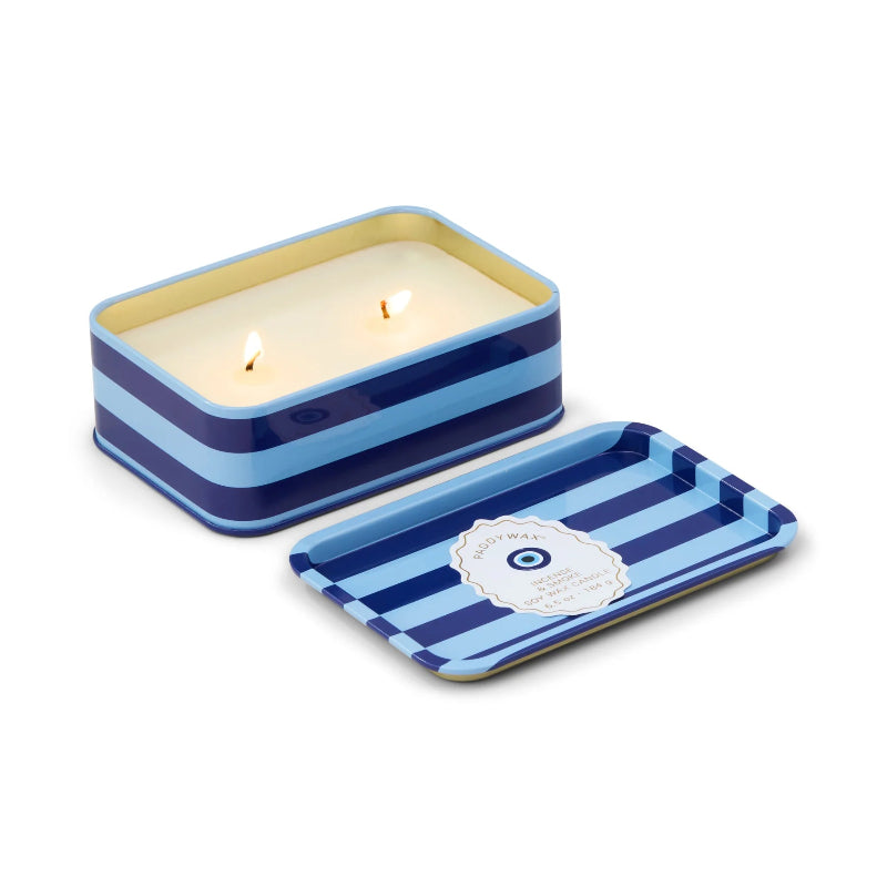 Rectangular striped candle in a tin with a lid on a white background