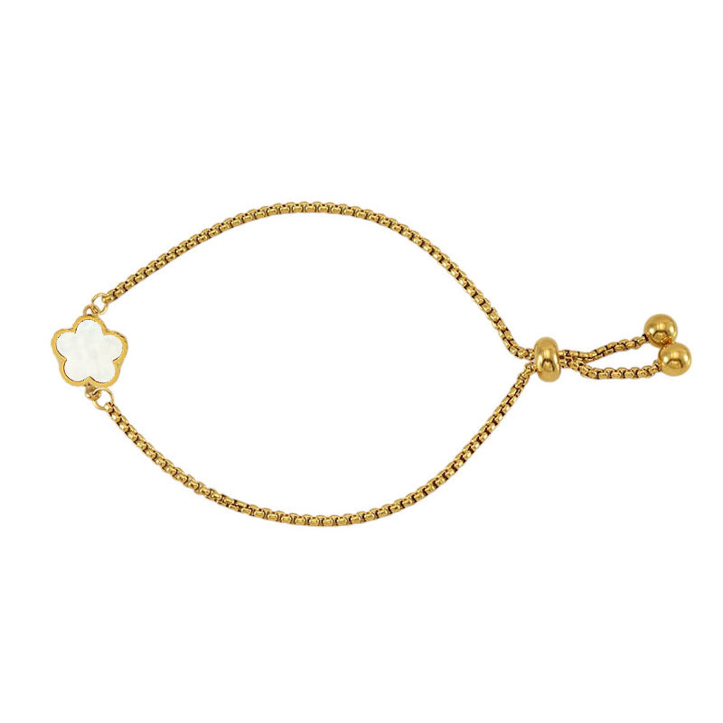 Adjustable chain flower bracelet in gold & mother of pearl on white background