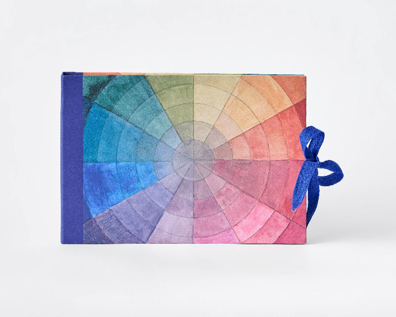 Color swatch book with a blue ribbon on a white background