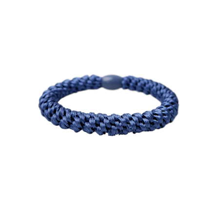 A blue braided elastic bracelet with a smooth, dark blue circular clasp, shown against a solid white background.