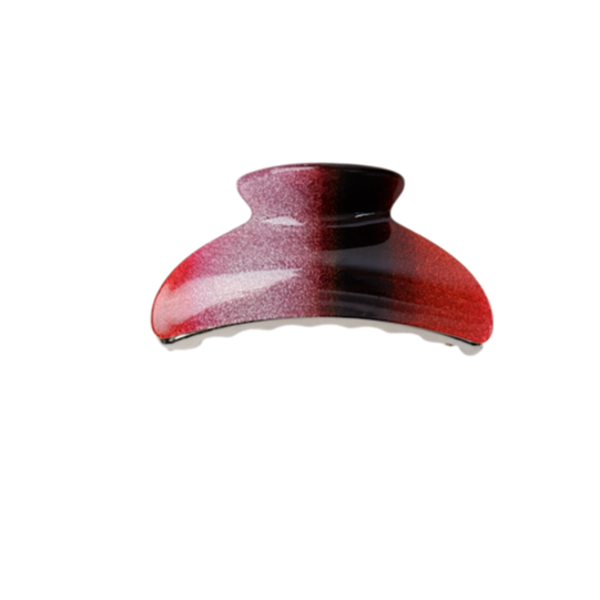 Red and black hair clip on a white background