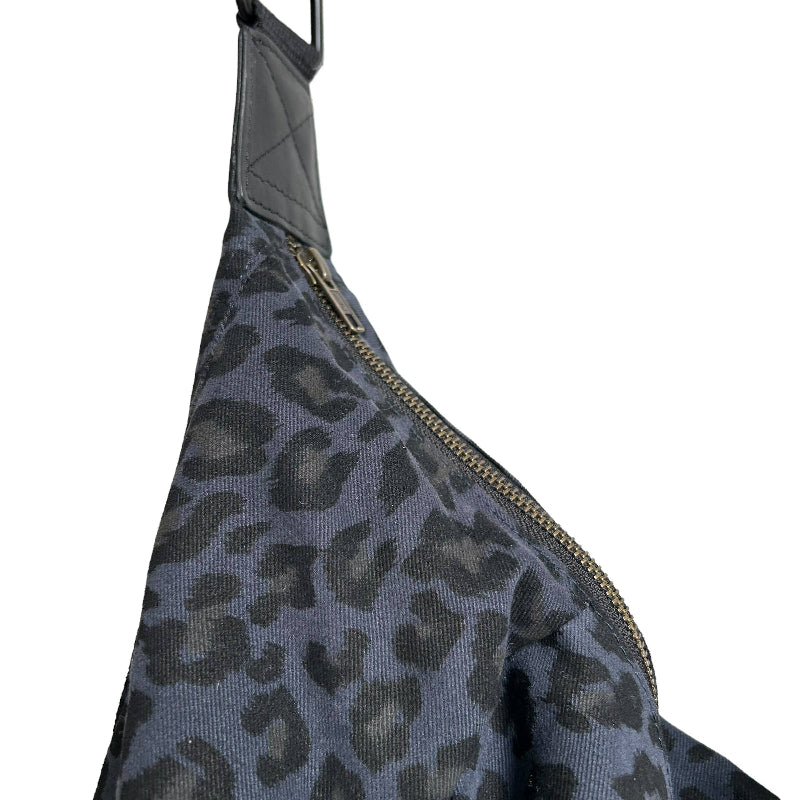 Leopard print bag with a gold zipper on a white background