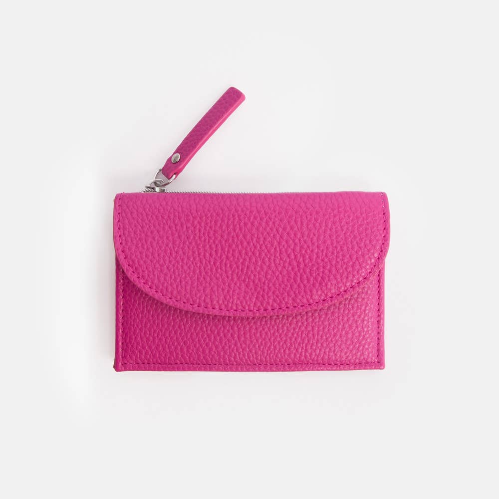 Pink textured clutch bag with a strap on a white background