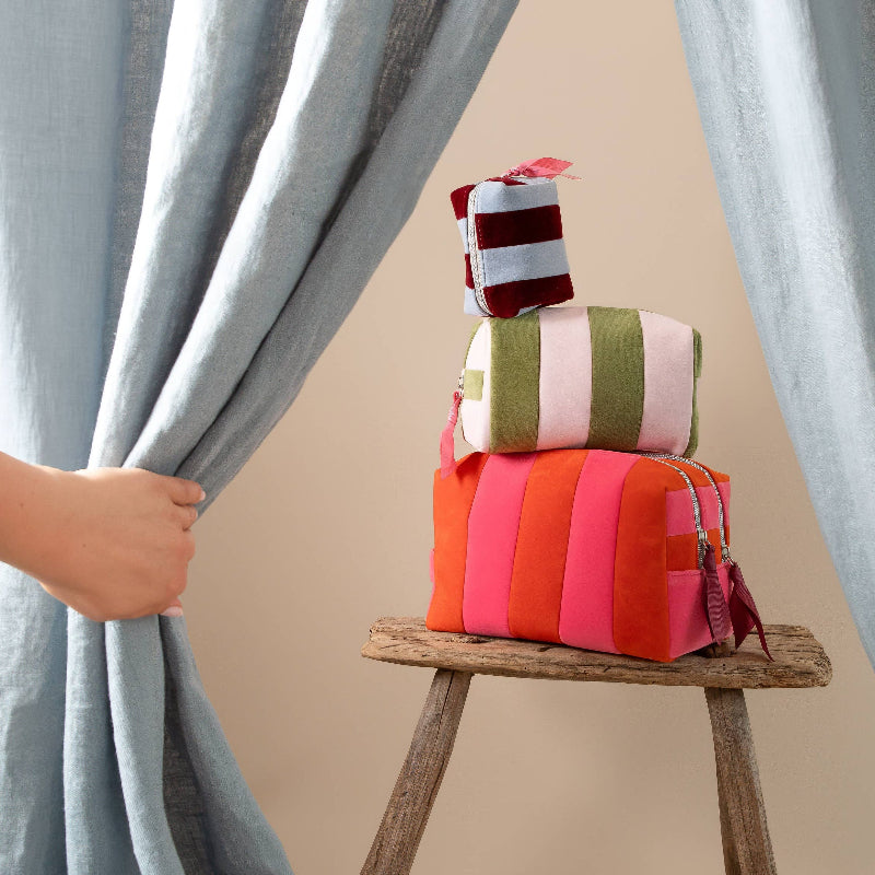 STACK OF STRIPED MAKE UP BAGS