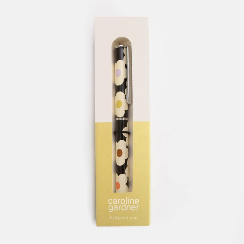 Pen with floral design in a branded box on a white background