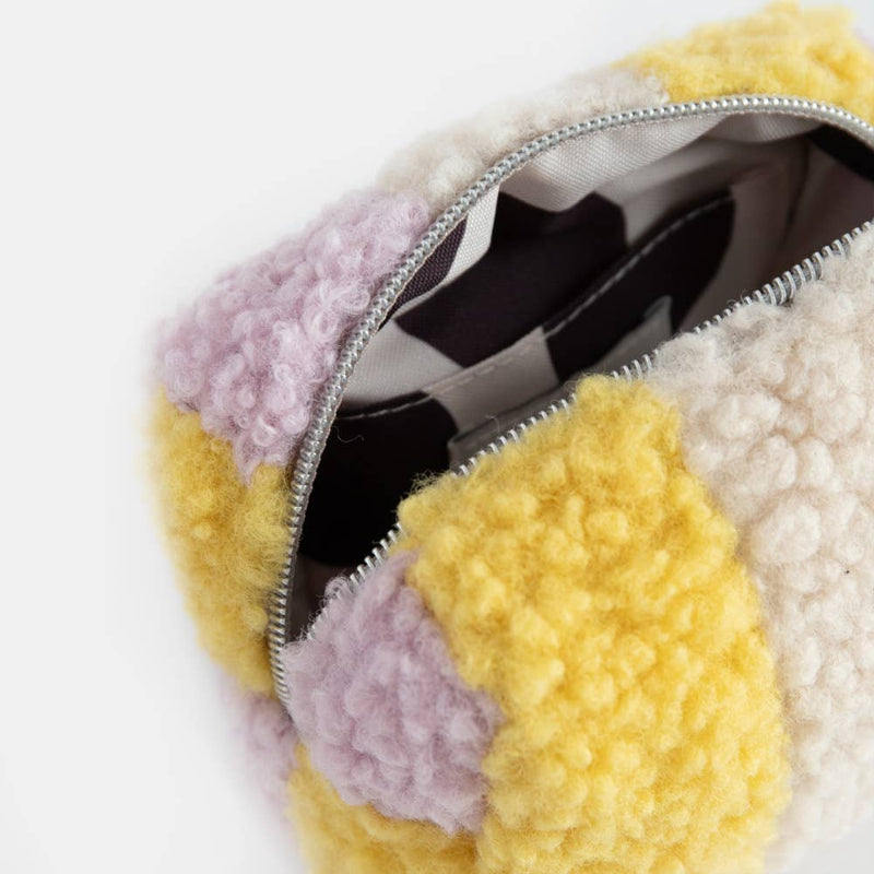 Multicolored textured pouch with a zipper on a white background