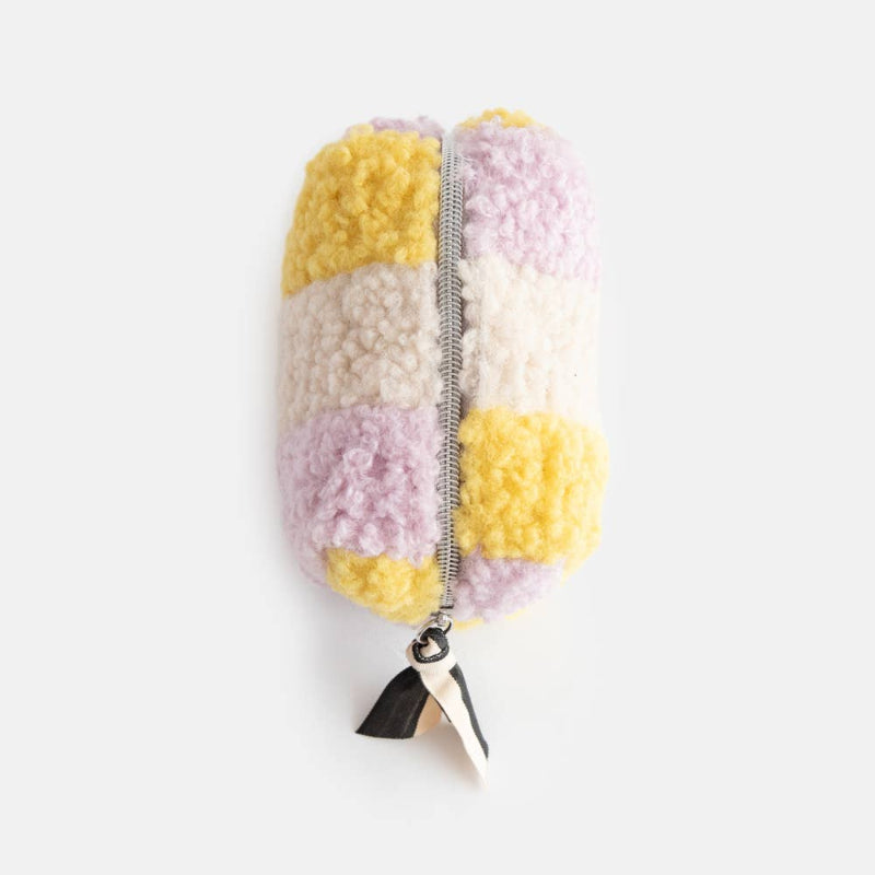 Colorful pom-pom pencil-shaped keychain on a white background