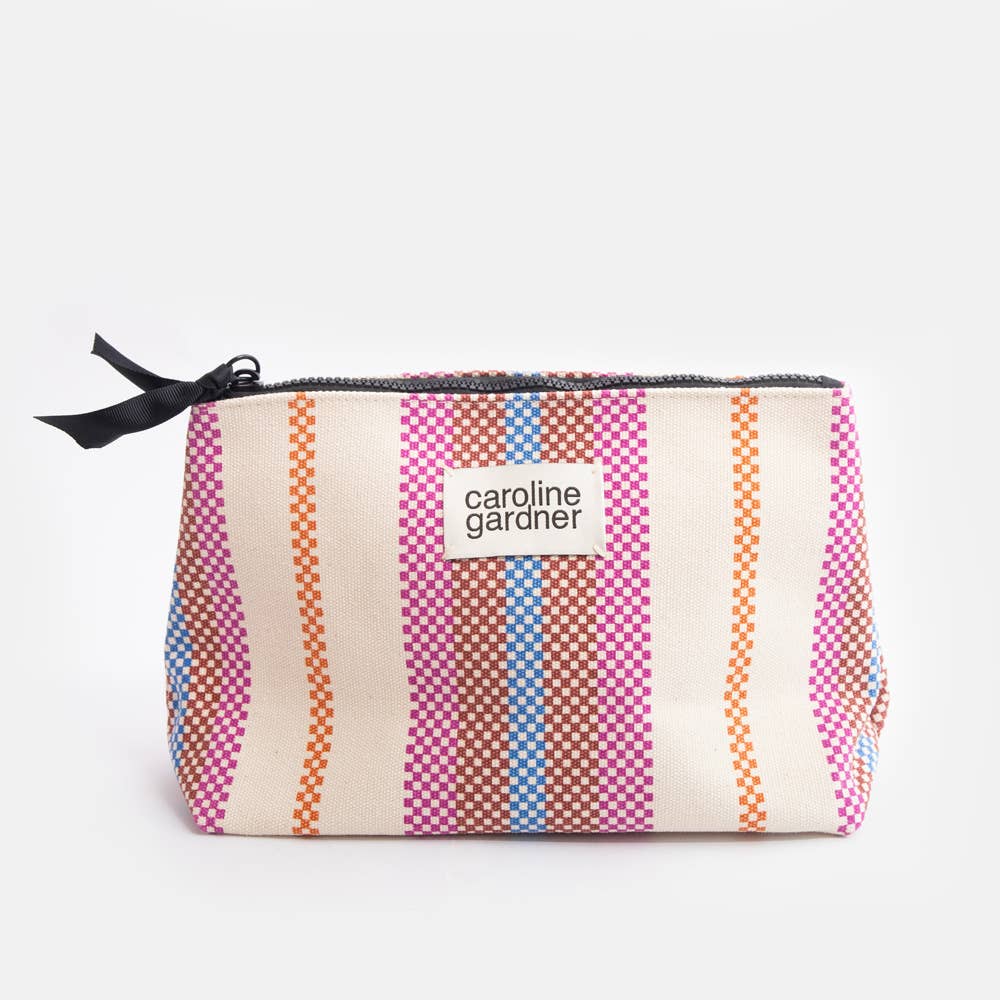 Caroline Gardner Striped pouch with a visible brand label on a white background