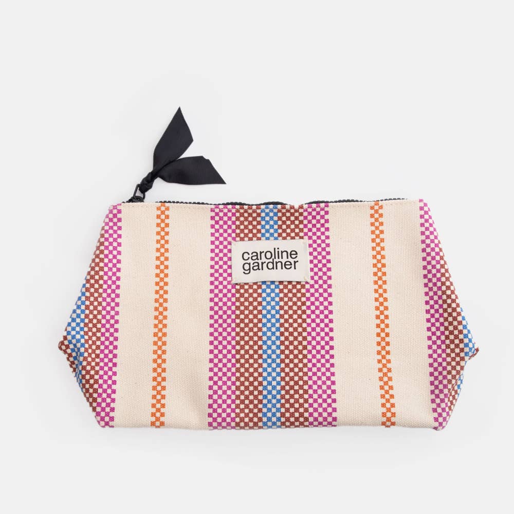 Colourful Caroline Gardner striped pouch with a visible brand label on a white background