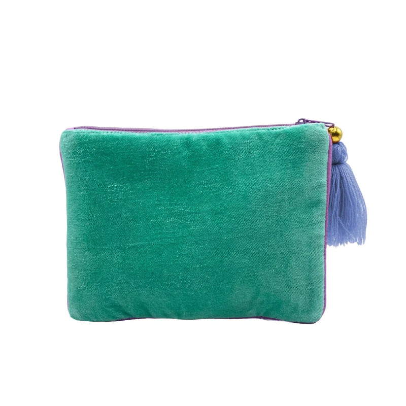 Green clutch bag with a tassel on a white background