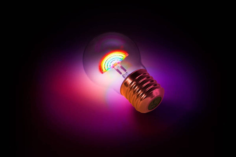 Colorful light bulb on a dark background