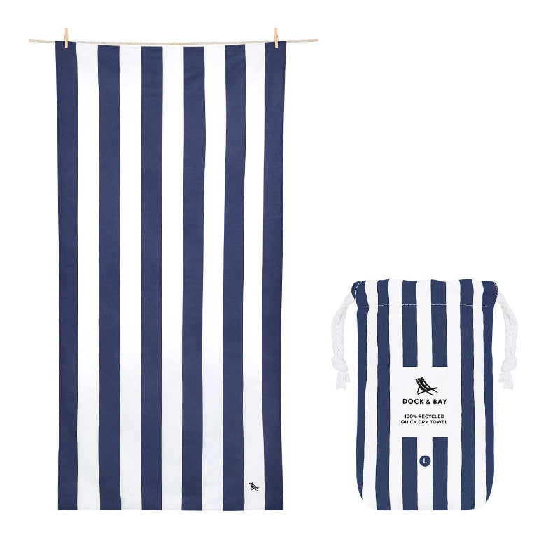 Navy and white striped towel and pouch with 'Dock & Bay' branding on a white background