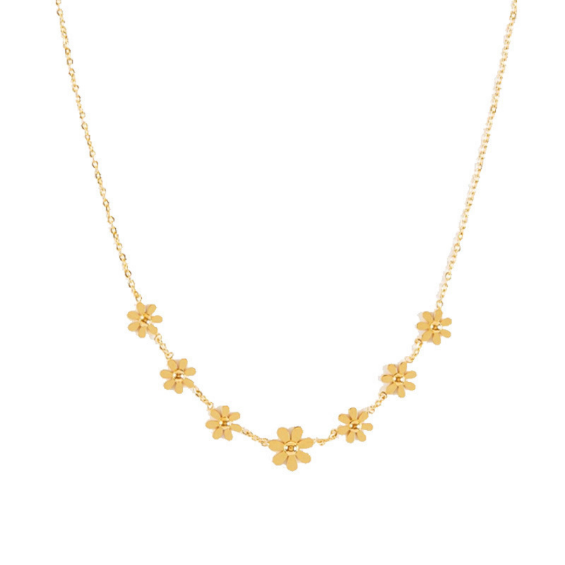 Gold floral DAISY necklace on a white background