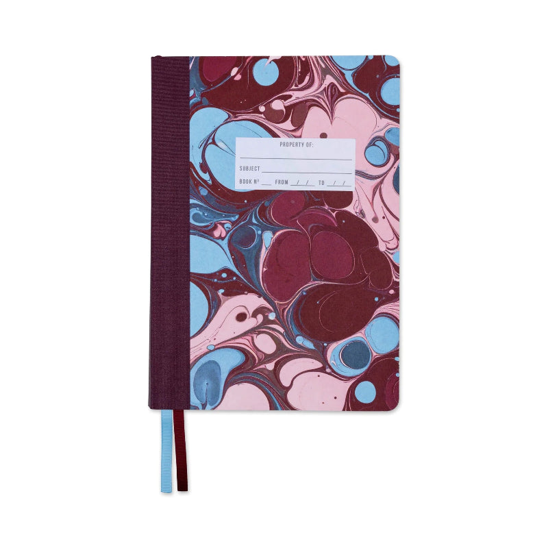 Notebook with a marbled cover design featuring pink, blue, and purple colors on a white background.