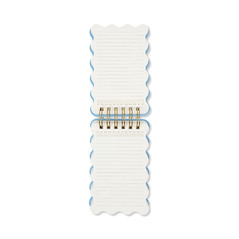 A vertical stack of scalloped-edge lined notepads held together by a gold spiral binder, shown on a plain white background.