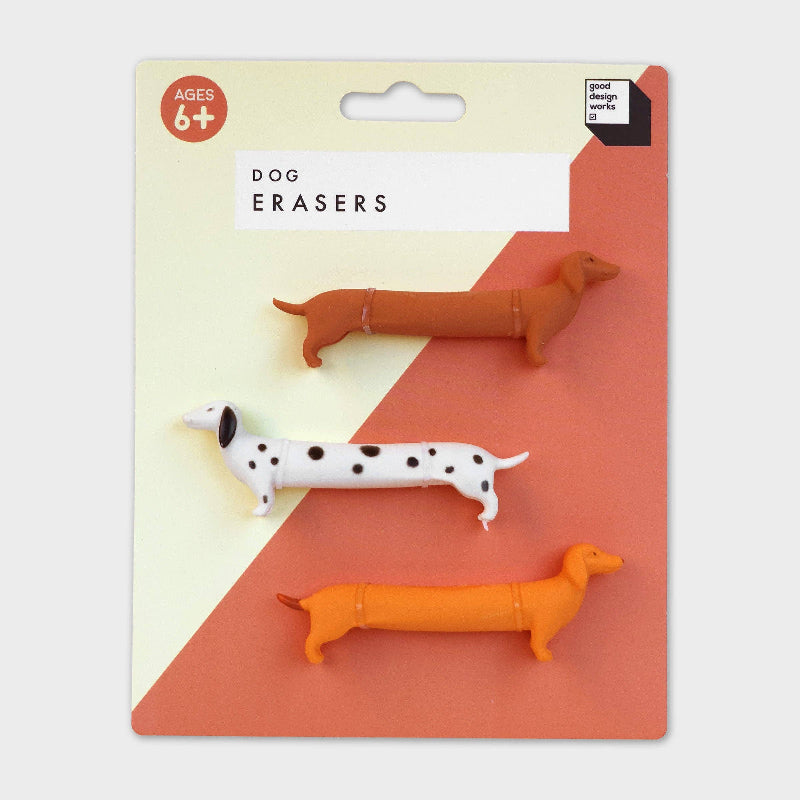 Packaging of dog erasers with three different colored dachshund-shaped erasers on a geometric patterned background.