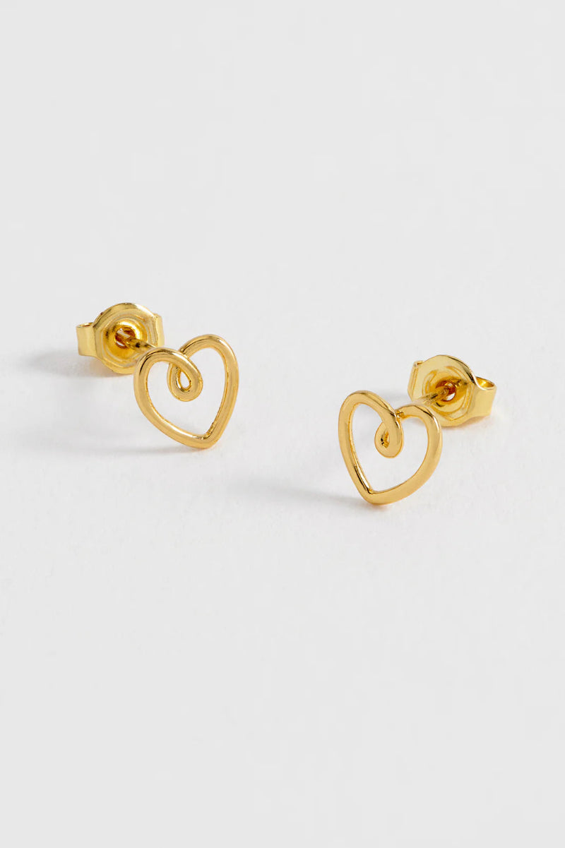 Gold heart-shaped stud earrings on a white background