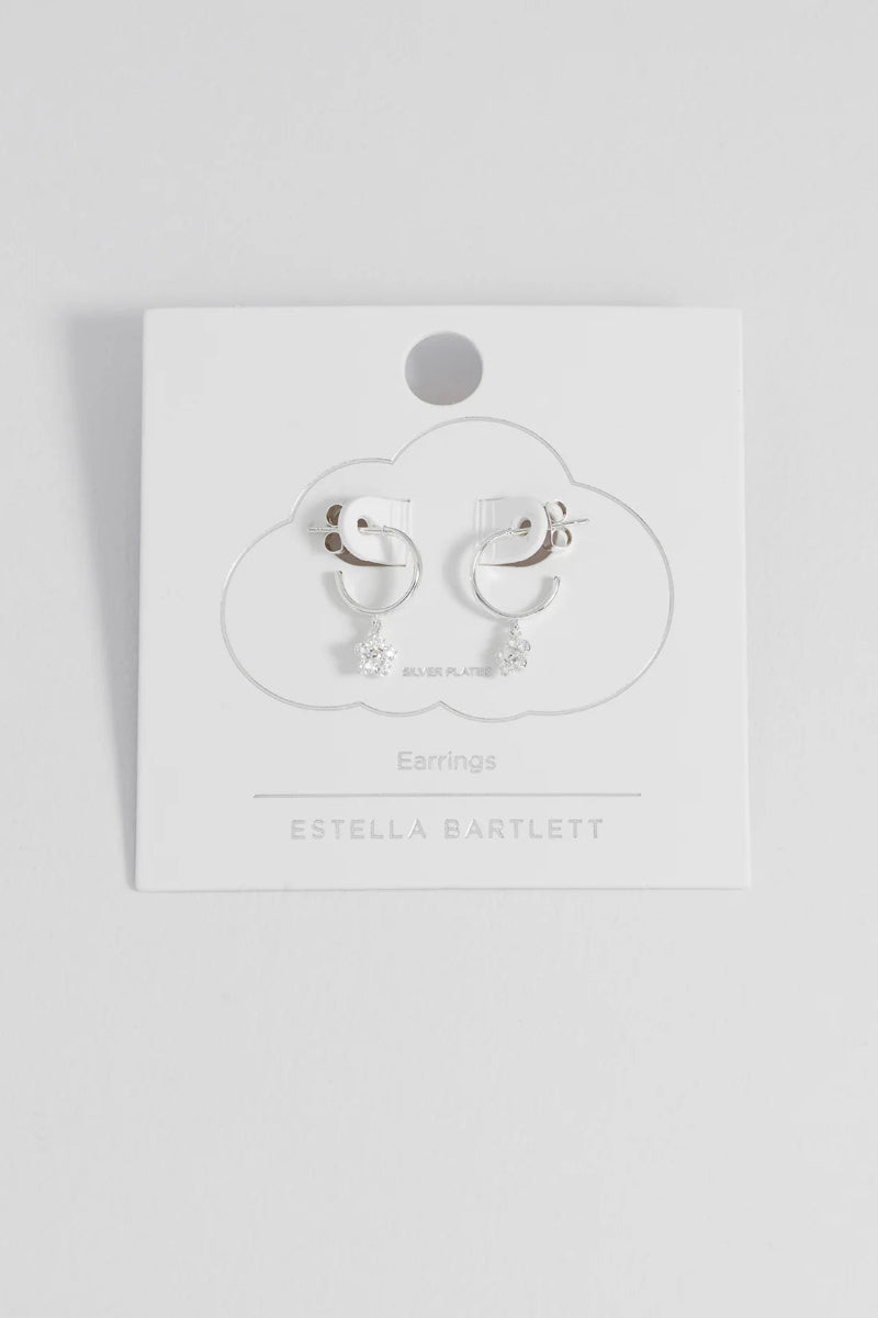 Pair of earrings on a branded card with 'Estella Bartlett' branding.