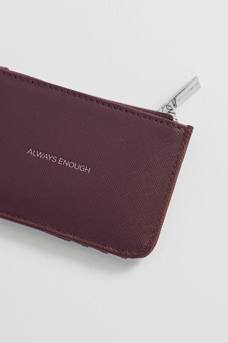 Brown pouch with 'ALWAYS ENOUGH' text on a white background