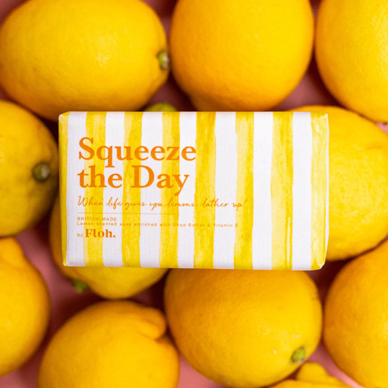 Bar of soap with 'Squeeze the Day' text surrounded by lemons